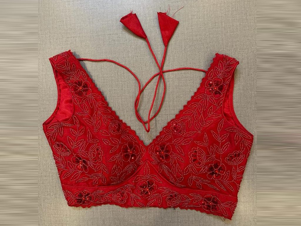 Buy red hand embroidered sleeveless saree blouse online in USA. Elevate your saree style with exquisite readymade sari blouses, embroidered saree blouses, Banarasi sari blouse, designer saree blouse, choli-cut blouses, corset blouses from Pure Elegance Indian fashion store in USA.-full view