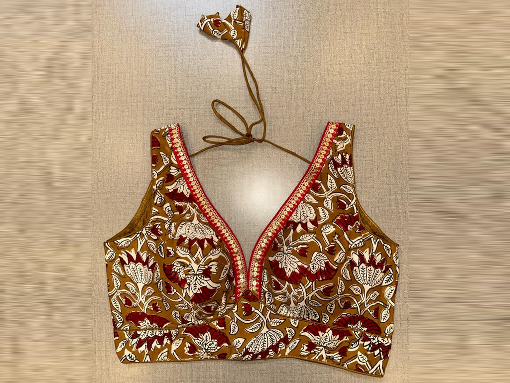 Shop brown printed sleeveless saree blouse online in USA with sequin lace. Elevate your saree style with exquisite readymade sari blouses, embroidered saree blouses, Banarasi sari blouse, designer saree blouse, choli-cut blouses, corset blouses from Pure Elegance Indian fashion store in USA.-full view