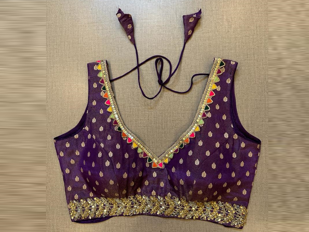 Buy purple sleeveless saree blouse online in USA with embellished lace border. Elevate your saree style with exquisite readymade sari blouses, embroidered saree blouses, Banarasi sari blouse, designer saree blouse, choli-cut blouses, corset blouses from Pure Elegance Indian fashion store in USA.-full view