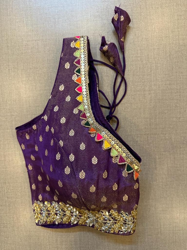 Buy purple sleeveless saree blouse online in USA with embellished lace border. Elevate your saree style with exquisite readymade sari blouses, embroidered saree blouses, Banarasi sari blouse, designer saree blouse, choli-cut blouses, corset blouses from Pure Elegance Indian fashion store in USA.-side