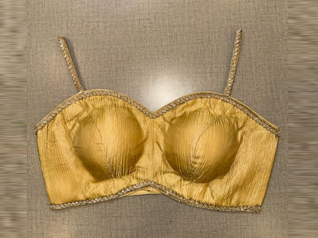 Shop golden tissue designer saree blouse online in USA with lace. Elevate your saree style with exquisite readymade sari blouses, embroidered saree blouses, Banarasi sari blouse, designer saree blouse, choli-cut blouses, corset blouses from Pure Elegance Indian fashion store in USA.-full view