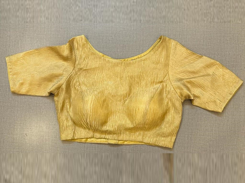 Buy golden crushed tissue designer saree blouse online in USA. Elevate your saree style with exquisite readymade sari blouses, embroidered saree blouses, Banarasi sari blouse, designer saree blouse, choli-cut blouses, corset blouses from Pure Elegance Indian fashion store in USA.-front