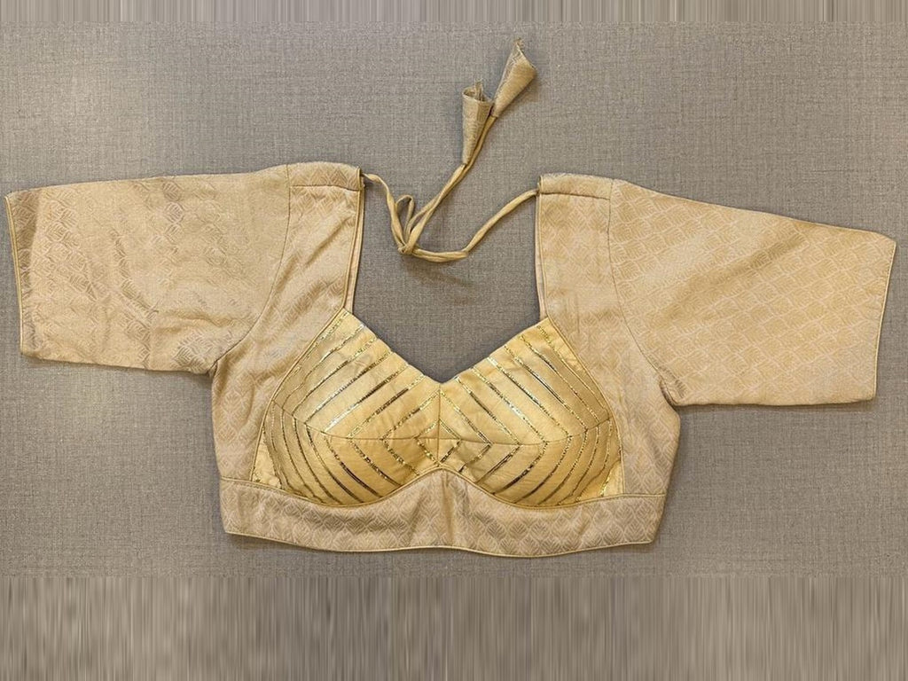 Buy stunning cream gota work Banarasi blouse online in USA. Elevate your saree style with exquisite readymade sari blouses, embroidered saree blouses, Banarasi sari blouse, designer saree blouse, choli-cut blouses, corset blouses from Pure Elegance Indian fashion store in USA.-front