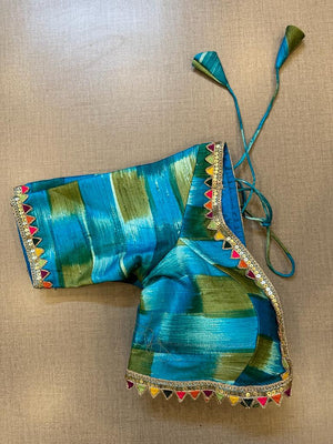Shop blue and green designer blouse online in USA with multicolor lace. Elevate your saree style with exquisite readymade sari blouses, embroidered saree blouses, Banarasi sari blouse, designer saree blouse, choli-cut blouses, corset blouses from Pure Elegance Indian fashion store in USA.-side