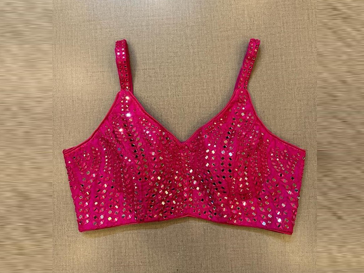Shop stunning rani pink mirror work strappy blouse online in USA. Elevate your saree style with exquisite readymade sari blouses, embroidered saree blouses, Banarasi sari blouse, designer saree blouse, choli-cut blouses, corset blouses from Pure Elegance Indian fashion store in USA.-full view