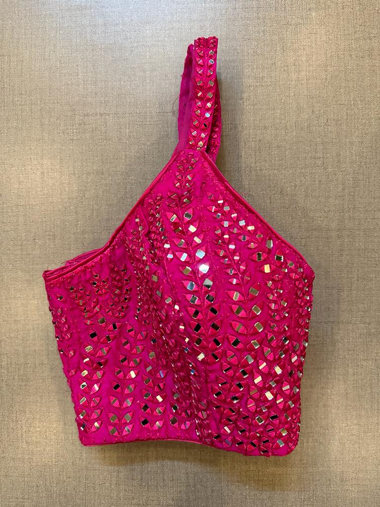Shop stunning rani pink mirror work strappy blouse online in USA. Elevate your saree style with exquisite readymade sari blouses, embroidered saree blouses, Banarasi sari blouse, designer saree blouse, choli-cut blouses, corset blouses from Pure Elegance Indian fashion store in USA.-side