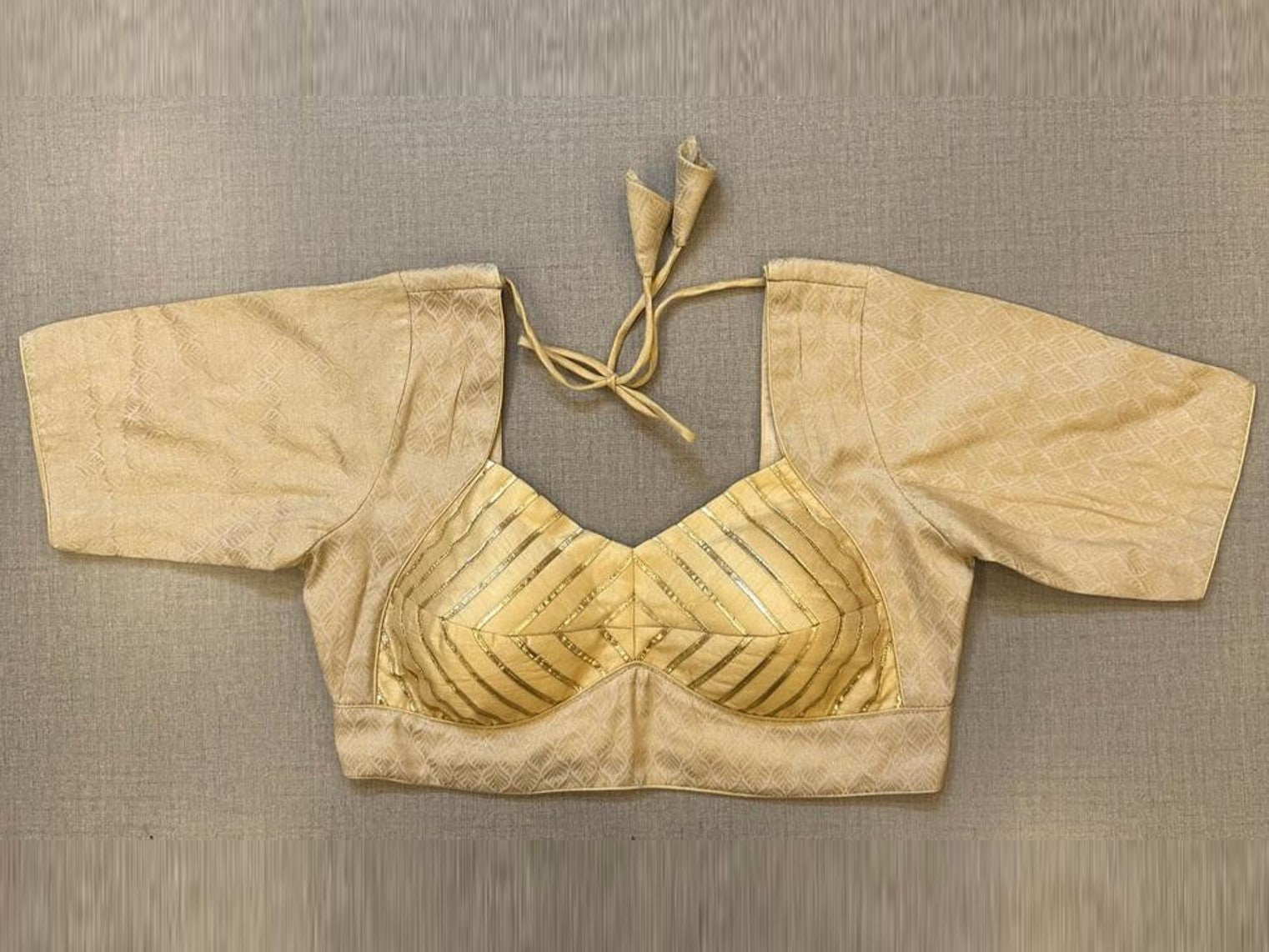 Shop stunning golden brocade blouse online in USA with gota lace. Elevate your saree style with exquisite readymade sari blouses, embroidered saree blouses, Banarasi sari blouse, designer saree blouse, choli-cut blouses, corset blouses from Pure Elegance Indian fashion store in USA.-full view