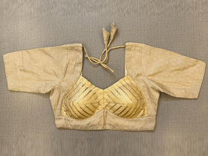 Shop stunning golden brocade blouse online in USA with gota lace. Elevate your saree style with exquisite readymade sari blouses, embroidered saree blouses, Banarasi sari blouse, designer saree blouse, choli-cut blouses, corset blouses from Pure Elegance Indian fashion store in USA.-full view