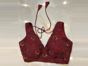 Shop wine hand embroidery sleeveless saree blouse online in USA. Elevate your saree style with exquisite readymade sari blouses, embroidered saree blouses, Banarasi sari blouse, designer saree blouse, choli-cut blouses, corset blouses from Pure Elegance Indian fashion store in USA.-front