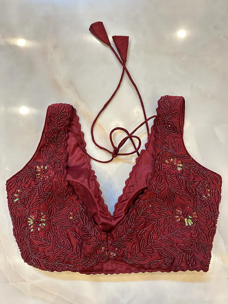 Shop wine hand embroidery sleeveless saree blouse online in USA. Elevate your saree style with exquisite readymade sari blouses, embroidered saree blouses, Banarasi sari blouse, designer saree blouse, choli-cut blouses, corset blouses from Pure Elegance Indian fashion store in USA.-back