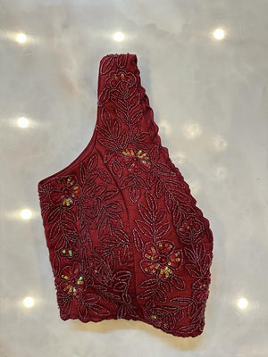 Shop wine hand embroidery sleeveless saree blouse online in USA. Elevate your saree style with exquisite readymade sari blouses, embroidered saree blouses, Banarasi sari blouse, designer saree blouse, choli-cut blouses, corset blouses from Pure Elegance Indian fashion store in USA.-side
