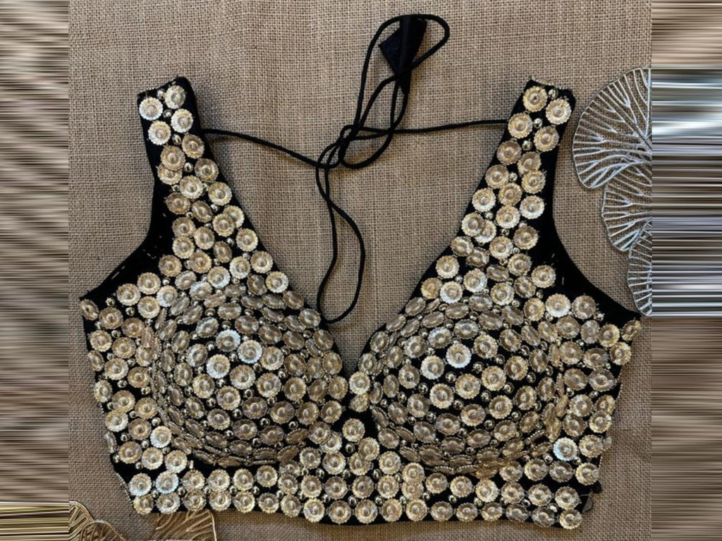 Buy black and golden coin work sleeveless saree blouse online in USA. Elevate your saree style with exquisite readymade sari blouses, embroidered saree blouses, Banarasi sari blouse, designer saree blouse, choli-cut blouses, corset blouses from Pure Elegance Indian fashion store in USA.-front