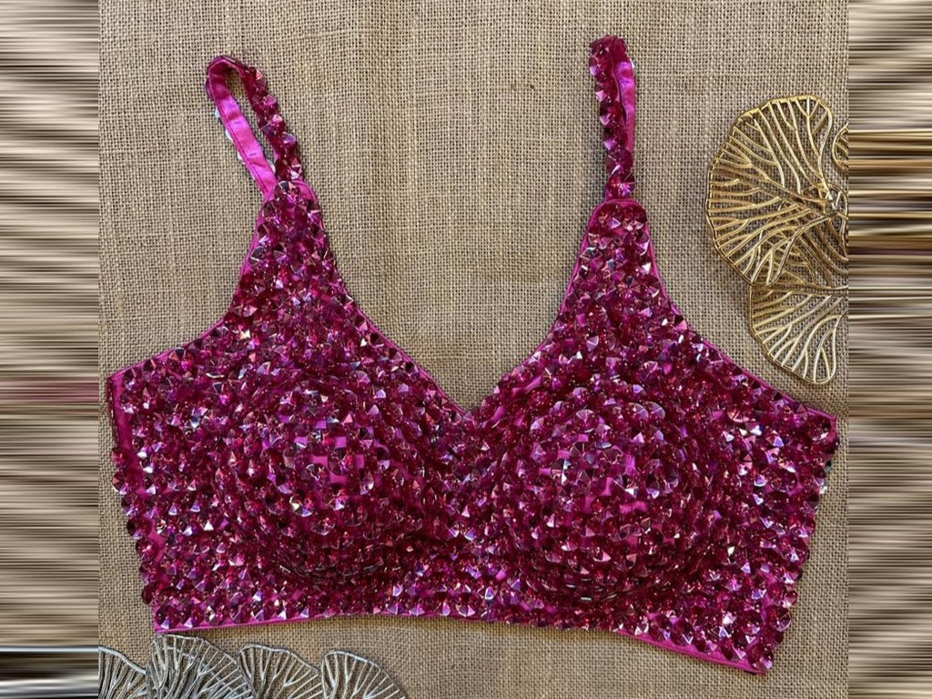 Shop fuschia pink bead work designer saree blouse online in USA. Elevate your saree style with exquisite readymade sari blouses, embroidered saree blouses, Banarasi sari blouse, designer saree blouse, choli-cut blouses, corset blouses from Pure Elegance Indian fashion store in USA.-front