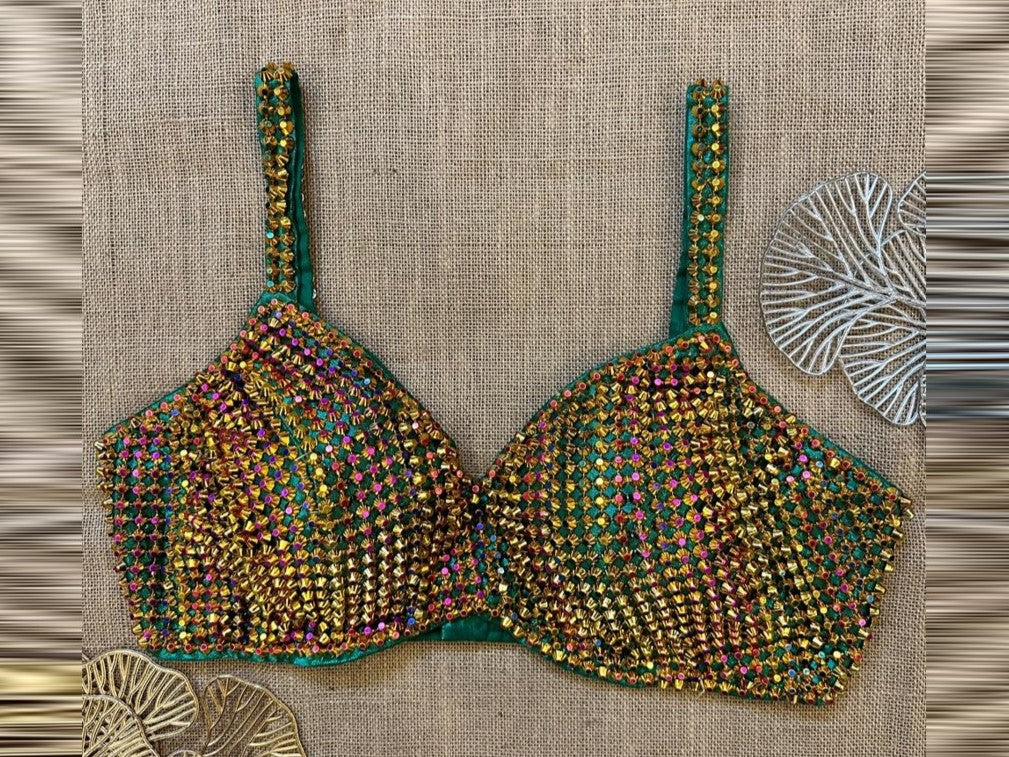 Shop stunning green embellished designer blouse online in USA. Elevate your saree style with exquisite readymade sari blouses, embroidered saree blouses, Banarasi sari blouse, designer saree blouse, choli-cut blouses, corset blouses from Pure Elegance Indian fashion store in USA.-front