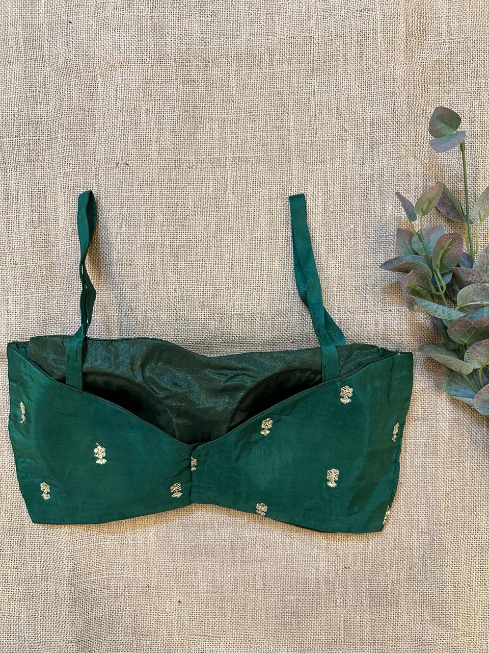 Shop dark green embroidered strappy designer blouse online in USA. Elevate your saree style with exquisite readymade saree blouses, embroidered saree blouses, Banarasi sari blouse, designer saree blouse, choli-cut blouses, corset blouses from Pure Elegance Indian fashion store in USA.-back