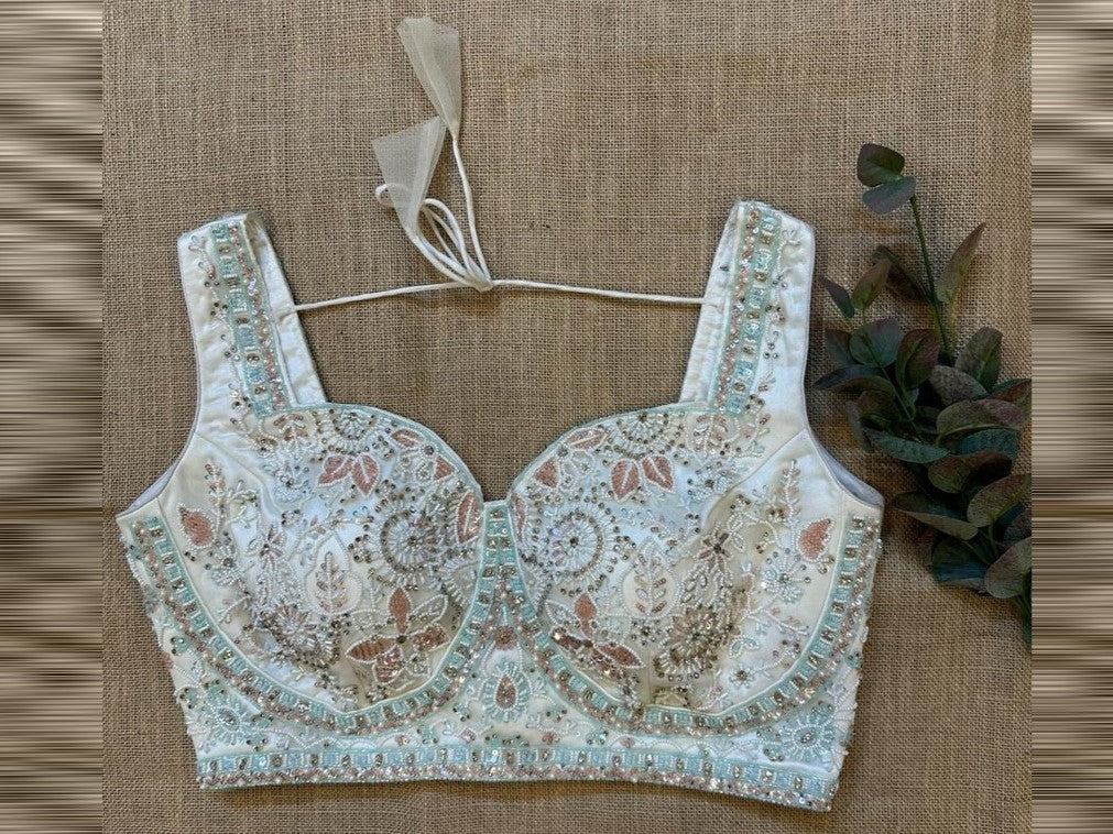 Shop mint green heavy embroidery sleeveless sari blouse online in USA. Elevate your saree style with exquisite readymade saree blouses, embroidered saree blouses, Banarasi sari blouse, designer saree blouse, choli-cut blouses, corset blouses from Pure Elegance Indian fashion store in USA.-front