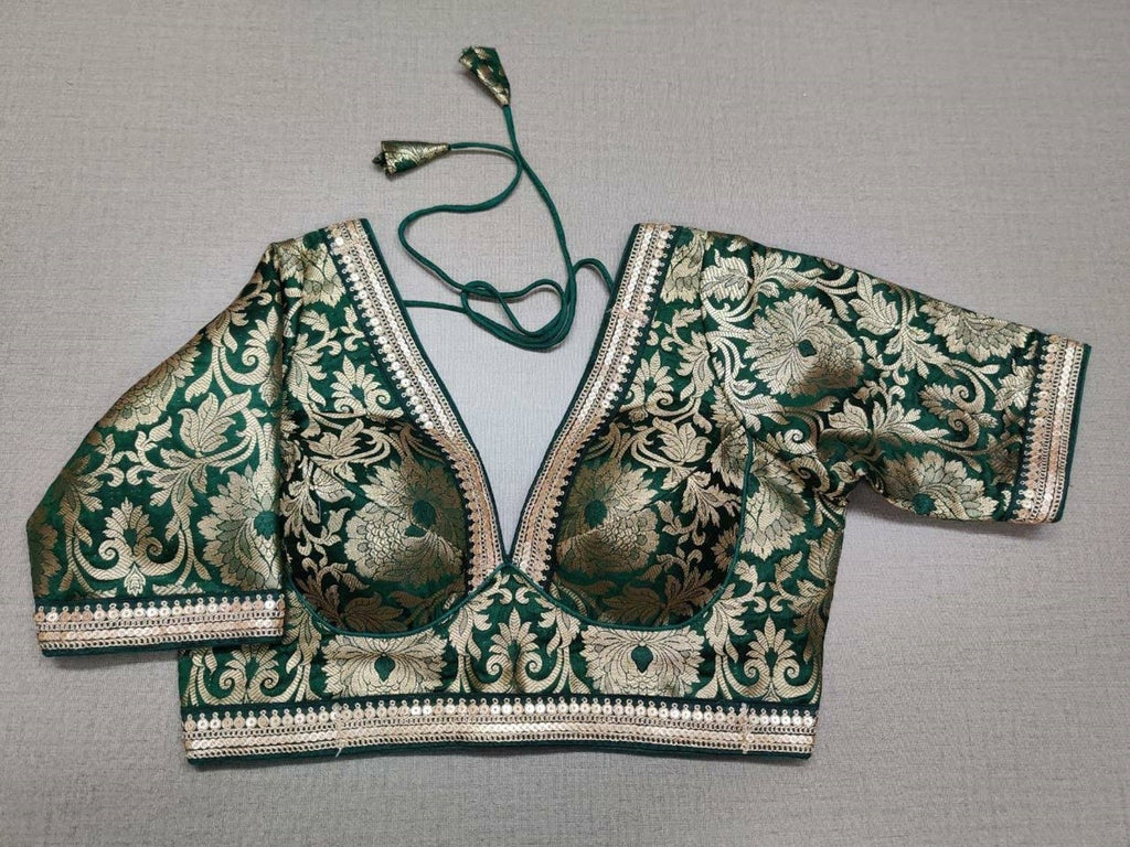 Shop dark green Banarasi saree blouse online in USA with sequin lace. Elevate your saree style with exquisite readymade saree blouses, embroidered saree blouses, Banarasi saree blouse, designer sari blouse, choli-cut blouses, corset blouses from Pure Elegance Indian fashion store in USA.-full view