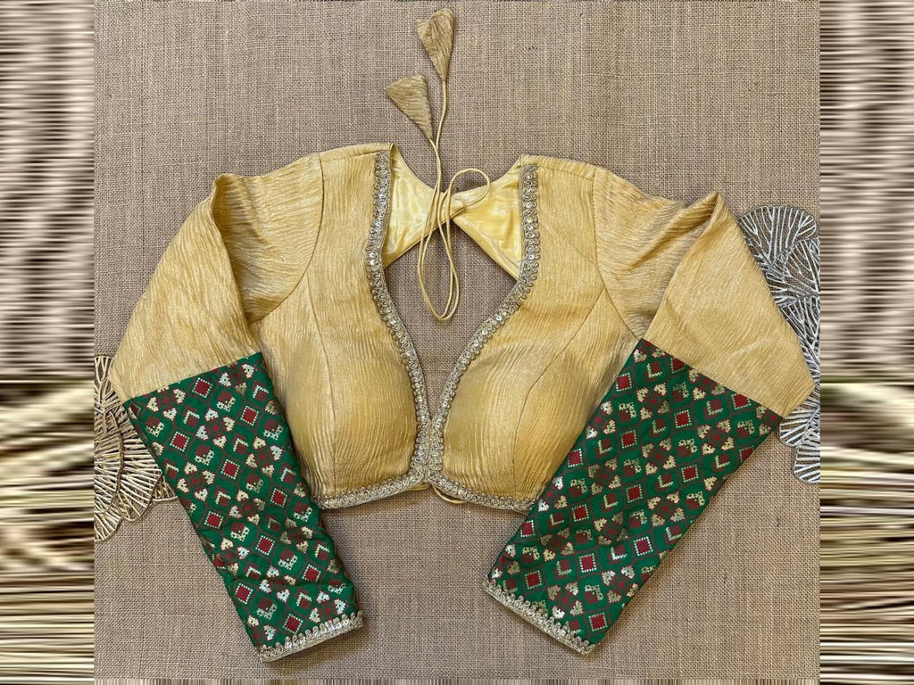 Shop golden tissue saree blouse online in USA with Paithani sleeves. Elevate your saree style with exquisite readymade saree blouses, embroidered saree blouses, Banarasi saree blouse, designer sari blouse, choli-cut blouses, corset blouses from Pure Elegance Indian fashion store in USA.-full view