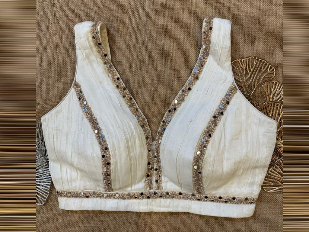 Buy off-white embroidered lace sleeveless saree blouse online in USA. Elevate your saree style with exquisite readymade saree blouses, embroidered saree blouses, Banarasi saree blouse, designer sari blouse, choli-cut blouses, corset blouses from Pure Elegance Indian fashion store in USA.-full view