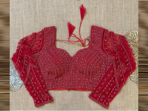 Buy red bead work sari blouse online in USA with net embroidered sleeves. Elevate your saree style with exquisite readymade saree blouses, embroidered saree blouses, Banarasi saree blouse, designer sari blouse, choli-cut blouses, corset blouses from Pure Elegance Indian fashion store in USA.-full view