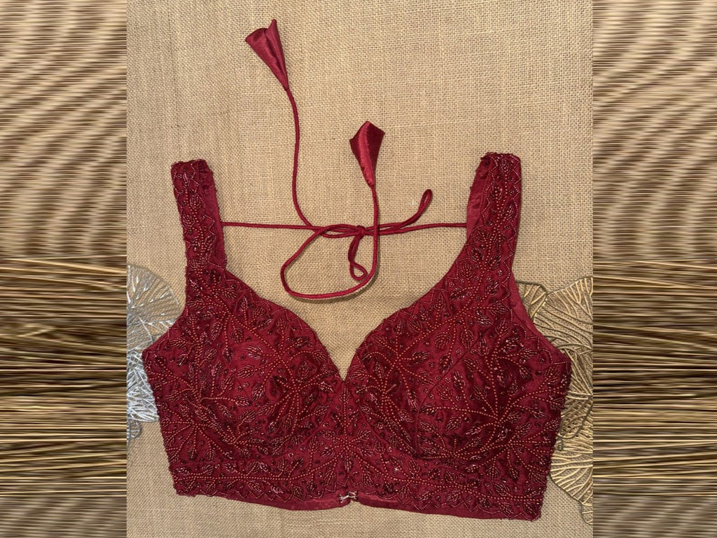 Shop red bead work sleeveless saree blouse online in USA. Elevate your sarees with exquisite readymade saree blouses, designer sari blouse, choli-cut blouses.-full view