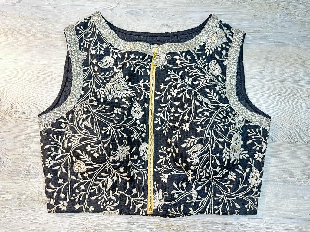 Buy navy blue silver embroidered blouse with zip closure in front. Make a fashion statement on festive occasions and weddings with designer blouses, designer sarees, designer suits, Indian dresses, designer gowns, sharara suits, and embroidered sarees from Pure Elegance Indian fashion store in the USA.