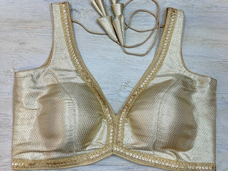 Buy off white silk blouse With embroidered edges. Make a fashion statement on festive occasions and weddings with designer blouses, designer sarees, designer suits, Indian dresses, designer gowns, sharara suits, and embroidered sarees from Pure Elegance Indian fashion store in the USA.