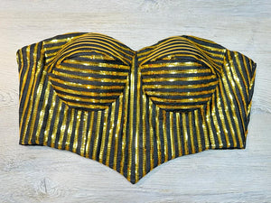 Buy black & golden stripped-off-shoulder blouse with a sequin embroidery blouse. Make a fashion statement on festive occasions and weddings with designer blouses, designer sarees, designer suits, Indian dresses, designer gowns, sharara suits, and embroidered sarees from Pure Elegance Indian fashion store in the USA.