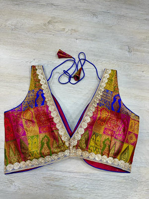 Buy red sleeveless silk blouse with multicolor self-embroidery. Make a fashion statement on festive occasions and weddings with designer blouses, designer sarees, designer suits, Indian dresses, designer gowns, sharara suits, and embroidered sarees from Pure Elegance Indian fashion store in the USA.