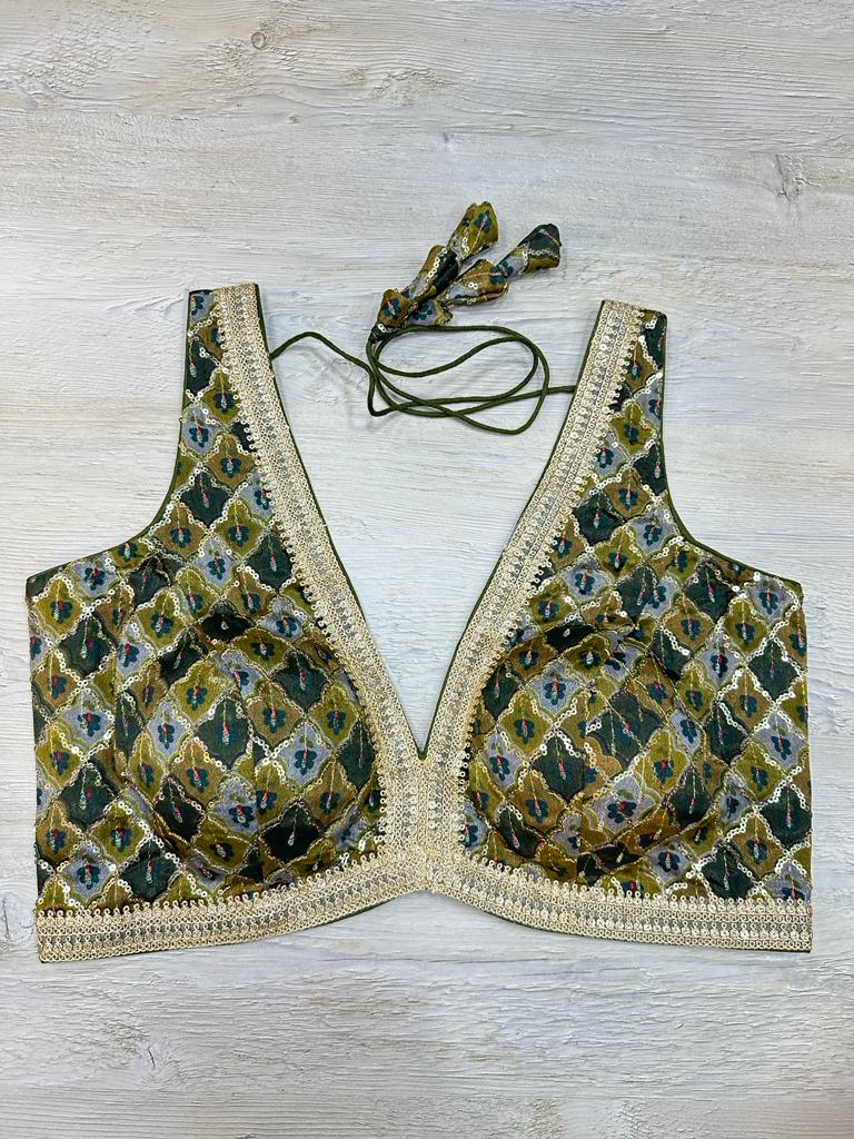 Buy green sleeveless blouse with printed, sequin-embroidered. Make a fashion statement on festive occasions and weddings with designer blouses, designer sarees, designer suits, Indian dresses, designer gowns, sharara suits, and embroidered sarees from Pure Elegance Indian fashion store in the USA.