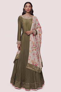 Shop beautiful olive green muslin Anarkali suit online in USA with georgette dupatta. Shop the best and latest designs in embroidered sarees, designer sarees, Anarkali suit, lehengas, sharara suits for weddings and special occasions from Pure Elegance Indian fashion store in USA.-full view