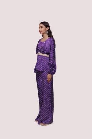 Shop stunning purple bandhej print satin palazzo set online in USA. Shop the best and latest designs in embroidered sarees, designer sarees, Anarkali suit, lehengas, sharara suits for weddings and special occasions from Pure Elegance Indian fashion store in USA.-palazzo