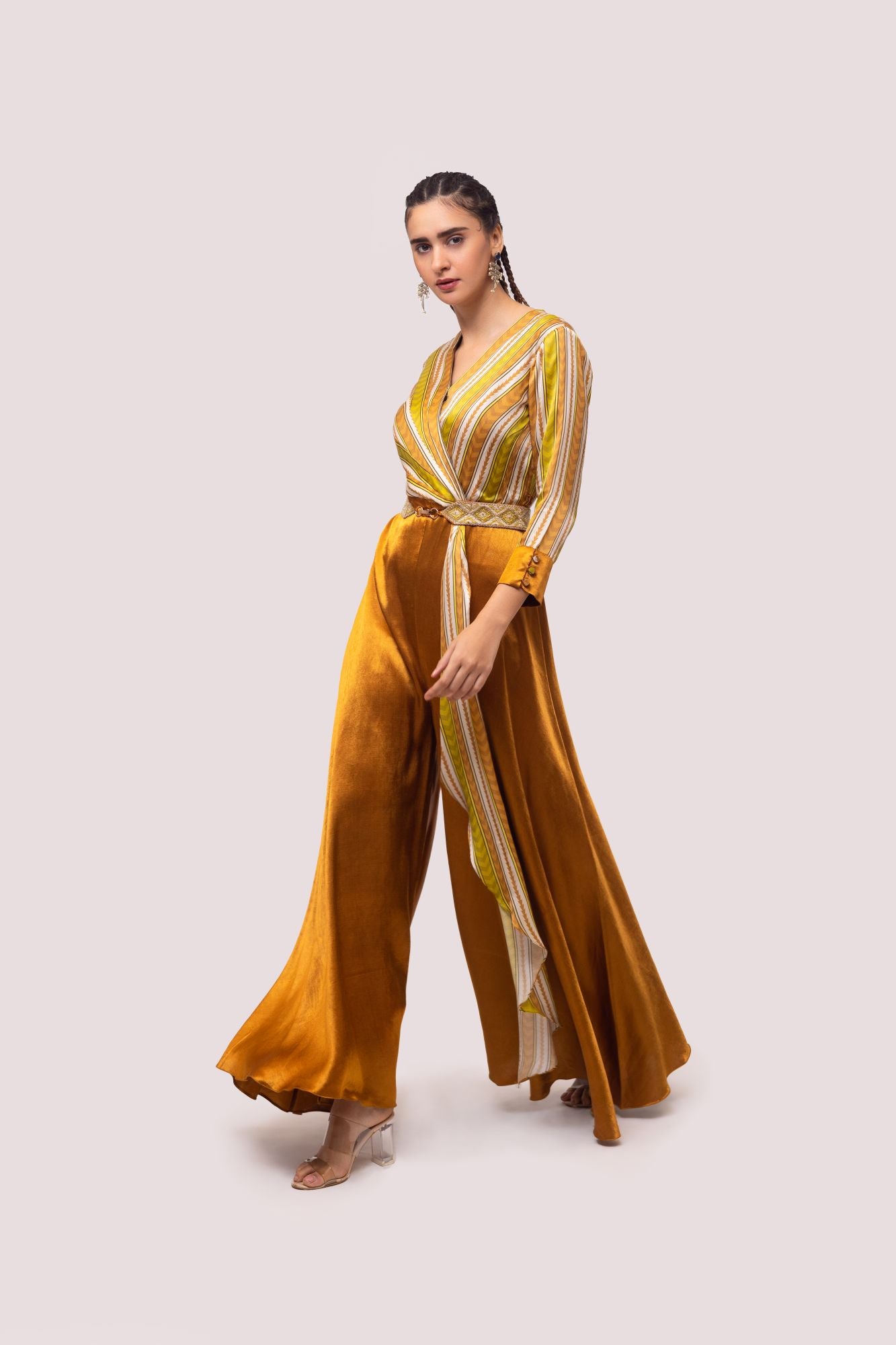 Buy brown and mustard striped satin silk jumpsuit online in USA. Shop the best and latest designs in embroidered sarees, designer sarees, Anarkali suit, lehengas, sharara suits for weddings and special occasions from Pure Elegance Indian fashion store in USA.-jumpsuit