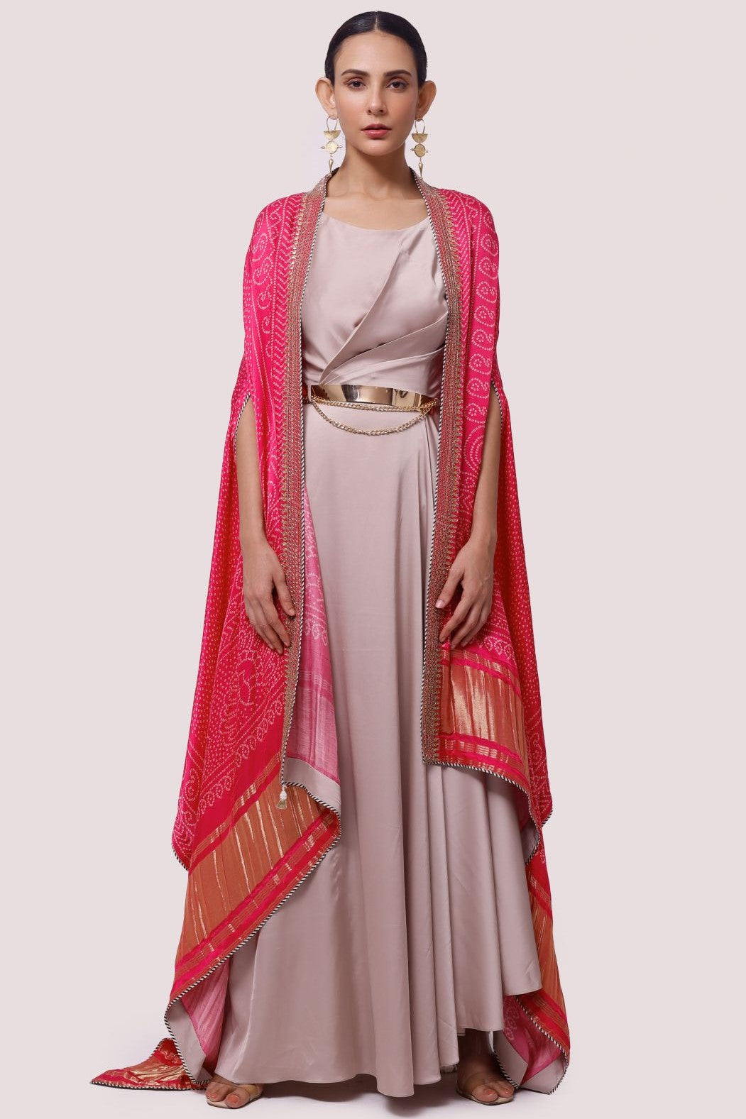 Buy beige satin maxi dress online in USA with pink embroidered cape. Shop the best and latest designs in embroidered sarees, designer sarees, Anarkali suit, lehengas, sharara suits for weddings and special occasions from Pure Elegance Indian fashion store in USA.-full view