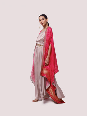 Buy beige satin maxi dress online in USA with pink embroidered cape. Shop the best and latest designs in embroidered sarees, designer sarees, Anarkali suit, lehengas, sharara suits for weddings and special occasions from Pure Elegance Indian fashion store in USA.-side