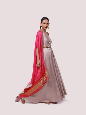 Buy beige satin maxi dress online in USA with pink embroidered cape. Shop the best and latest designs in embroidered sarees, designer sarees, Anarkali suit, lehengas, sharara suits for weddings and special occasions from Pure Elegance Indian fashion store in USA.-side