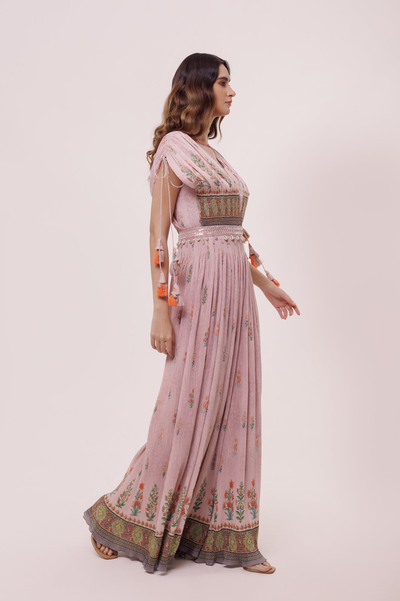 Buy stunning light pink crushed fabric jumpsuit online in USA. Shop the best and latest designs in embroidered sarees, designer sarees, Anarkali suit, lehengas, sharara suits for weddings and special occasions from Pure Elegance Indian fashion store in USA.-side