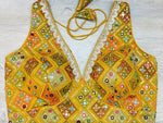 Buy yellow multicolor sleeveless blouse with thread and mirror embroidery. Make a fashion statement on festive occasions and weddings with designer blouses, designer sarees, designer suits, Indian dresses, designer gowns, sharara suits, and embroidered sarees from Pure Elegance Indian fashion store in the USA.