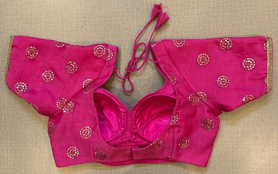 Buy a pink blouse with sequin embroidered patches and short sleeves. Make a fashion statement on festive occasions and weddings with designer blouses, designer sarees, designer suits, Indian dresses, designer gowns, sharara suits, and embroidered sarees from Pure Elegance Indian fashion store in the USA.
