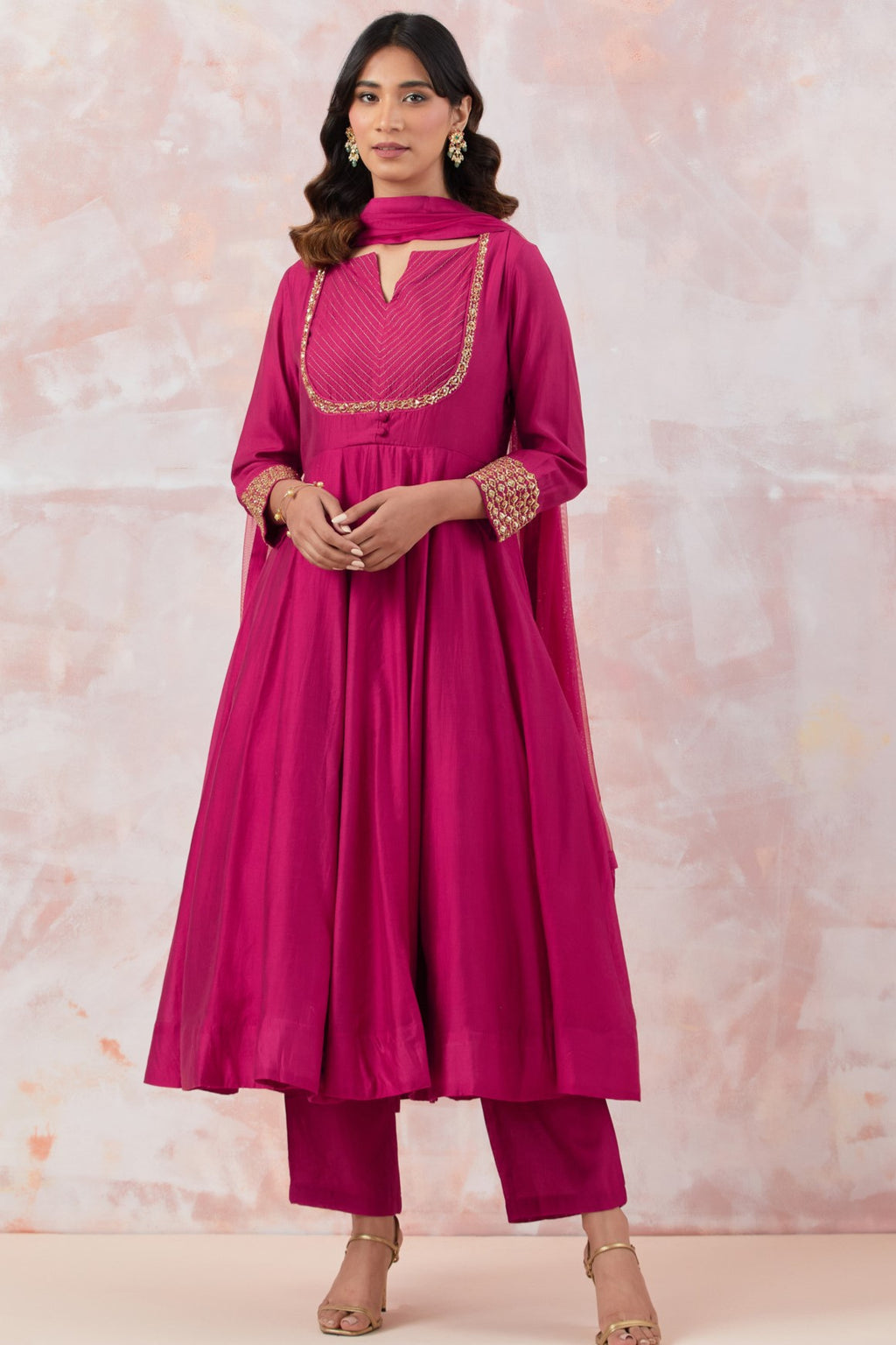 Buy a Pink Anarkali suit set with straight pants and a dupatta. It also has embroidery on the neck and sleeves. It is best suited for small parties. Dazzle on weddings and special occasions with exquisite Indian designer dresses, sharara suits, Anarkali suits, and wedding lehengas from Pure Elegance Indian fashion store in the USA.