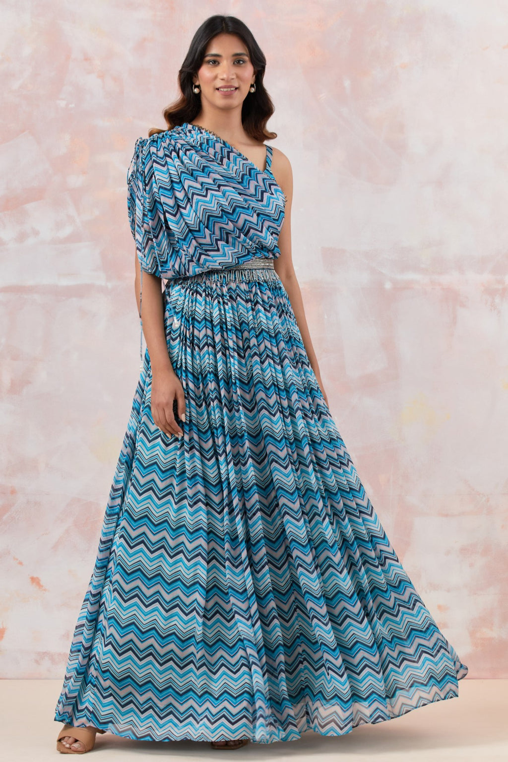 Buy a Blue stylish gown dress crafted in the softest Chinon fabric. the draped neckline brings in glamour. Dazzle on weddings and special occasions with exquisite Indian designer dresses, sharara suits, Anarkali suits, and wedding lehengas from Pure Elegance Indian fashion store in the USA.