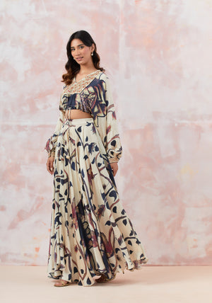 Buy Ivory embroidered skirt set featuring aari and beadwork, crafted in satin crepe. It is best for occasions & parties. Dazzle on weddings and special occasions with exquisite Indian designer dresses, sharara suits, Anarkali suits, and wedding lehengas from Pure Elegance Indian fashion store in the USA.