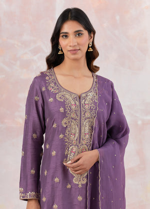 Buy a Purple suit set featuring Kurta with gotta pati and aari work, paired with a bottom and organza dupatta. Dazzle on weddings and special occasions with exquisite Indian designer dresses, sharara suits, Anarkali suits, and wedding lehengas from Pure Elegance Indian fashion store in the USA.