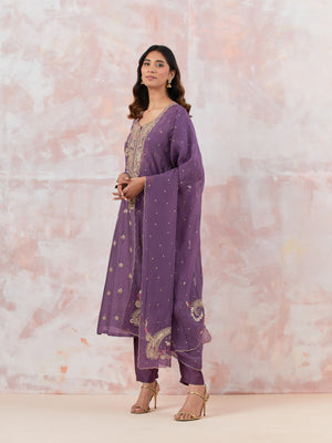 Buy a Purple suit set featuring Kurta with gotta pati and aari work, paired with a bottom and organza dupatta. Dazzle on weddings and special occasions with exquisite Indian designer dresses, sharara suits, Anarkali suits, and wedding lehengas from Pure Elegance Indian fashion store in the USA.