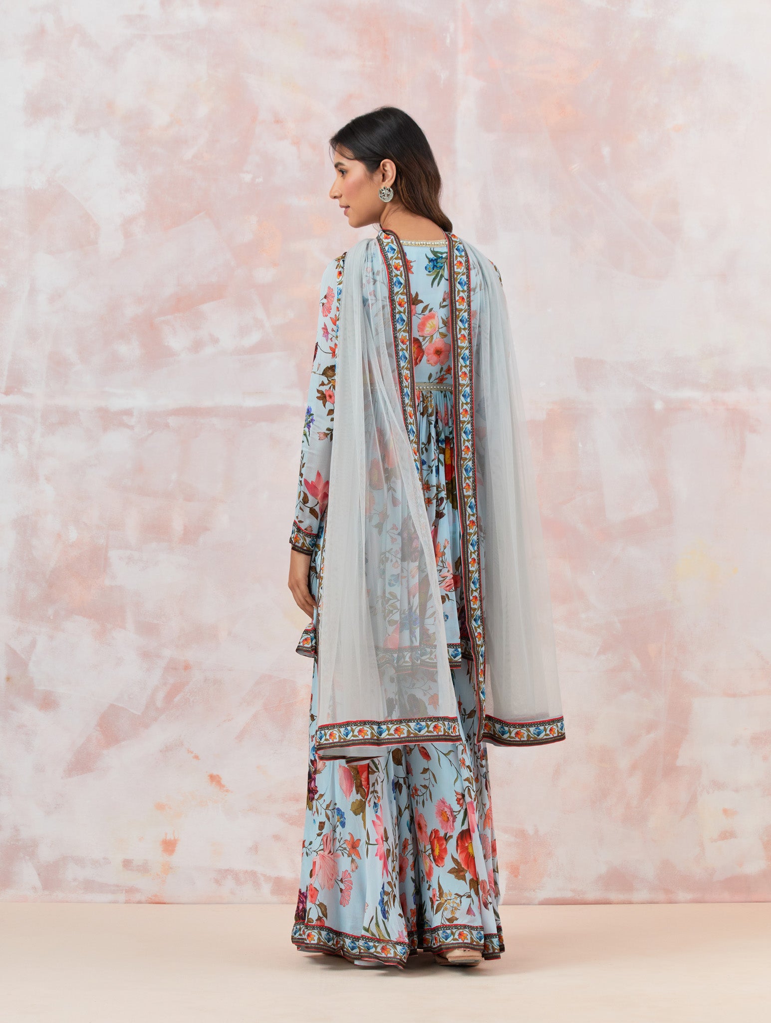 Buy a Blue Floral silk sharara suit set featuring Kurta with bead & cut dana work, V-neck, paired with sharara bottom and net dupatta. Dazzle on weddings and special occasions with exquisite Indian designer dresses, sharara suits, Anarkali suits, and wedding lehengas from Pure Elegance Indian fashion store in the USA.