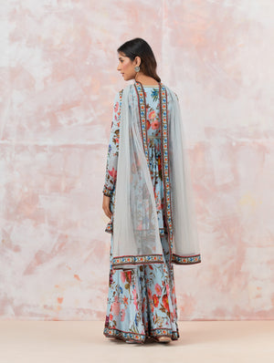 Buy a Blue Floral silk sharara suit set featuring Kurta with bead & cut dana work, V-neck, paired with sharara bottom and net dupatta. Dazzle on weddings and special occasions with exquisite Indian designer dresses, sharara suits, Anarkali suits, and wedding lehengas from Pure Elegance Indian fashion store in the USA.