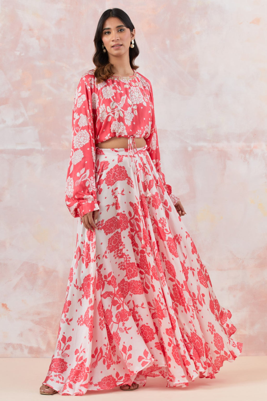 Buy a pink stylish floral skirt set features stunning floral motifs and cheenta handwork. Dazzle on weddings and special occasions with exquisite Indian designer dresses, sharara suits, Anarkali suits, and wedding lehengas from Pure Elegance Indian fashion store in the USA.