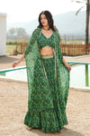Buy a green printed skirt set adorned with a v- neck blouse & printed cape. Dazzle on weddings and special occasions with exquisite Indian designer dresses, sharara suits, Anarkali suits, and wedding lehengas from Pure Elegance Indian fashion store in the USA.
