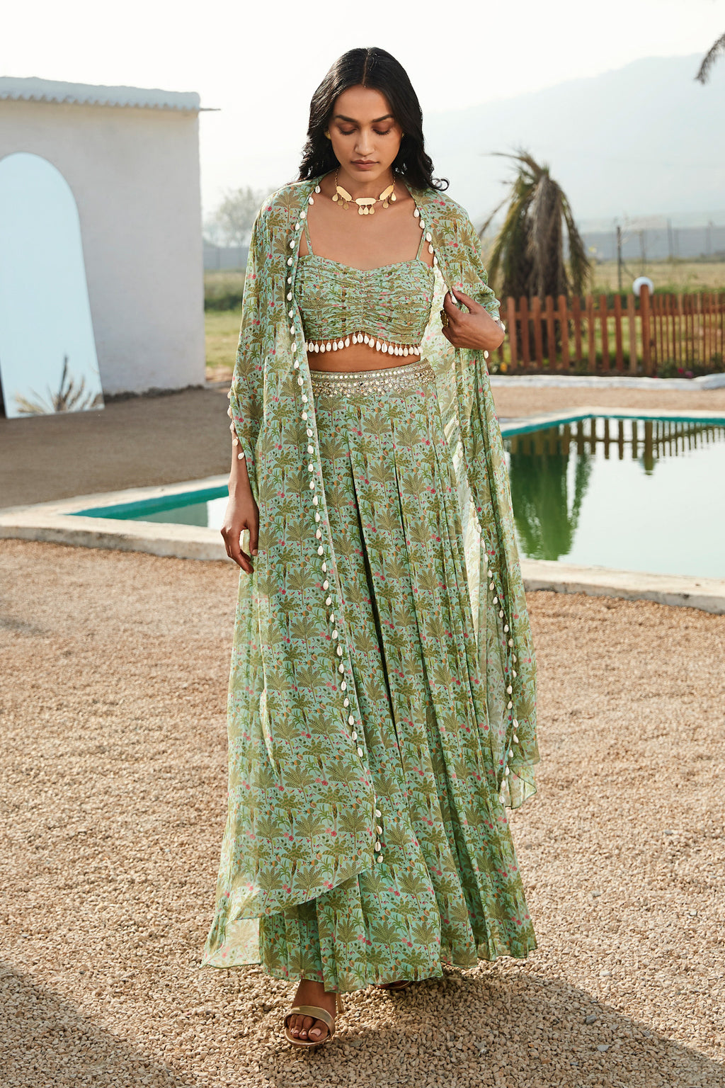 Buy printed green skirt set in georgette. Dazzle on weddings and special occasions with exquisite Indian designer dresses, sharara suits, Anarkali suits, and wedding lehengas from Pure Elegance Indian fashion store in the USA.