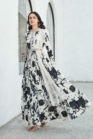 Buy a black & white floral printed full-sleeved, crepe floor-length kurta. Dazzle on weddings and special occasions with exquisite Indian designer dresses, sharara suits, Anarkali suits, and wedding lehengas from Pure Elegance Indian fashion store in the USA.